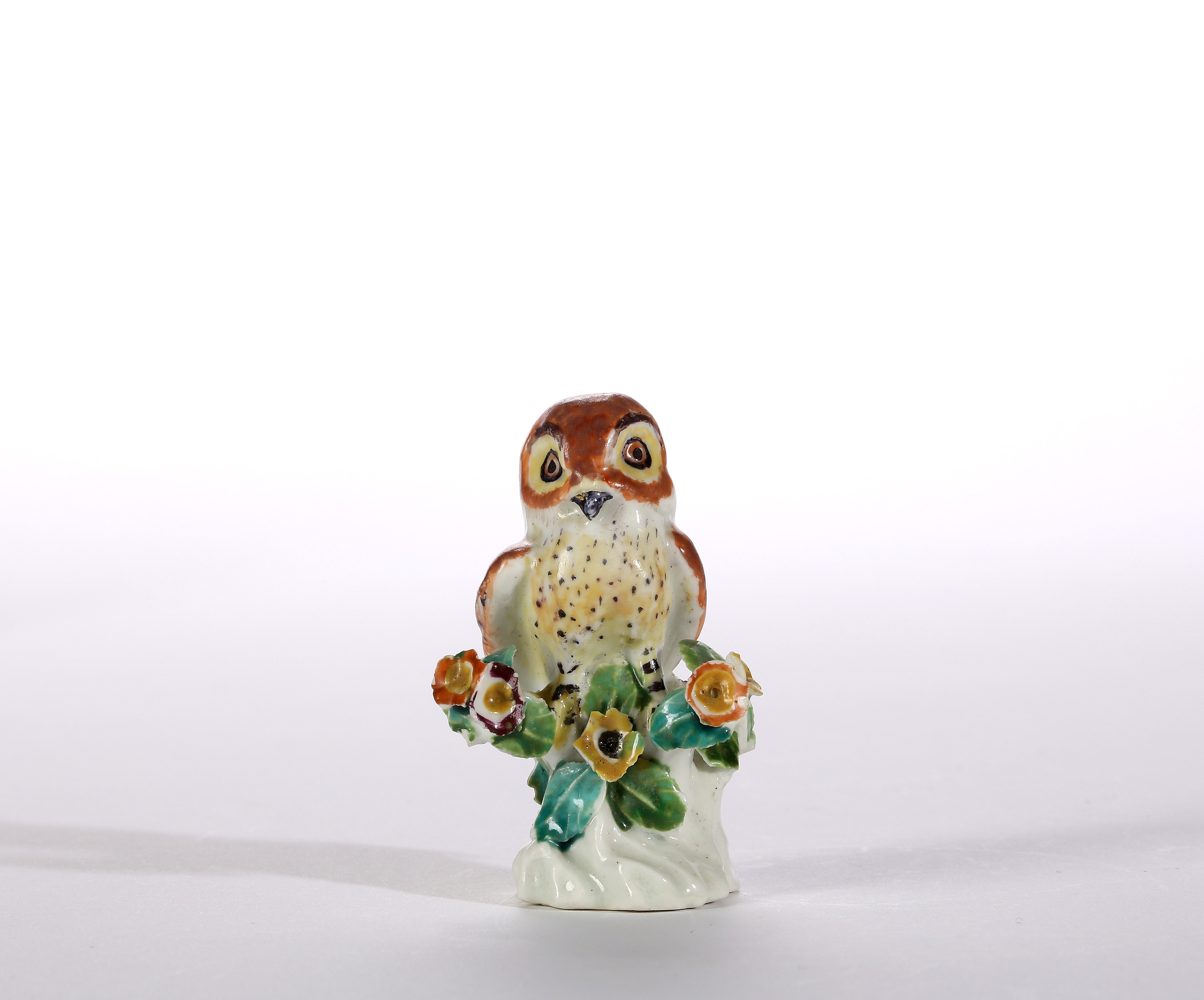 A SMALL DERBY MODEL OF AN OWL