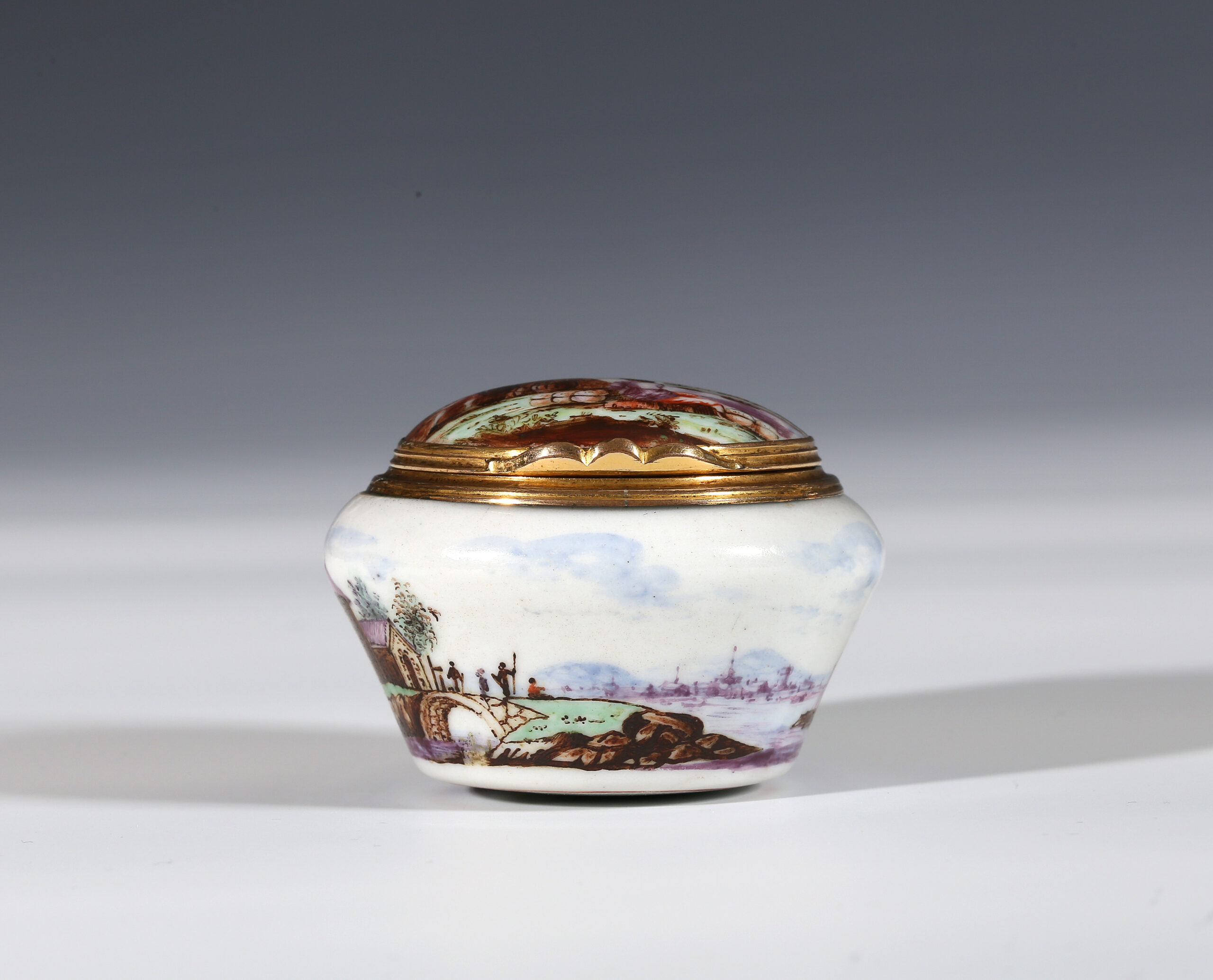 AN ‘A’-MARKED PORCELAIN GILT-METAL MOUNTED SNUFF BOX