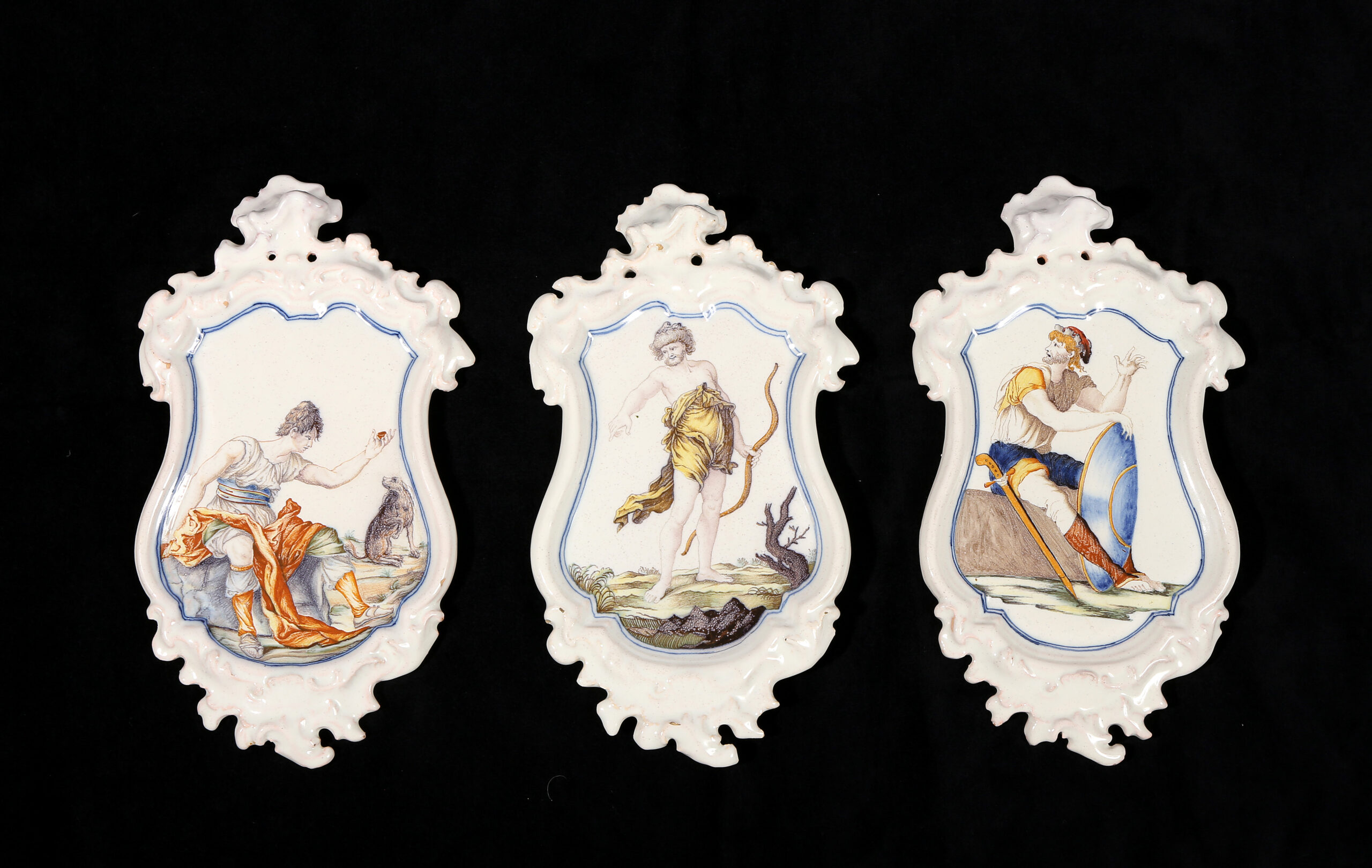 THREE ALCORA FAIENCE PLAQUES