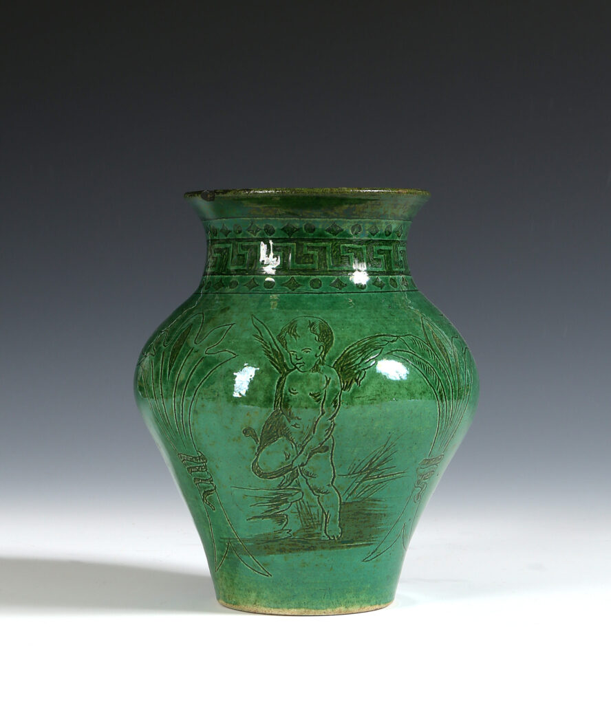 A GREEN GLAZED WILLIAM DE MORGAN SGRAFFITO VASE